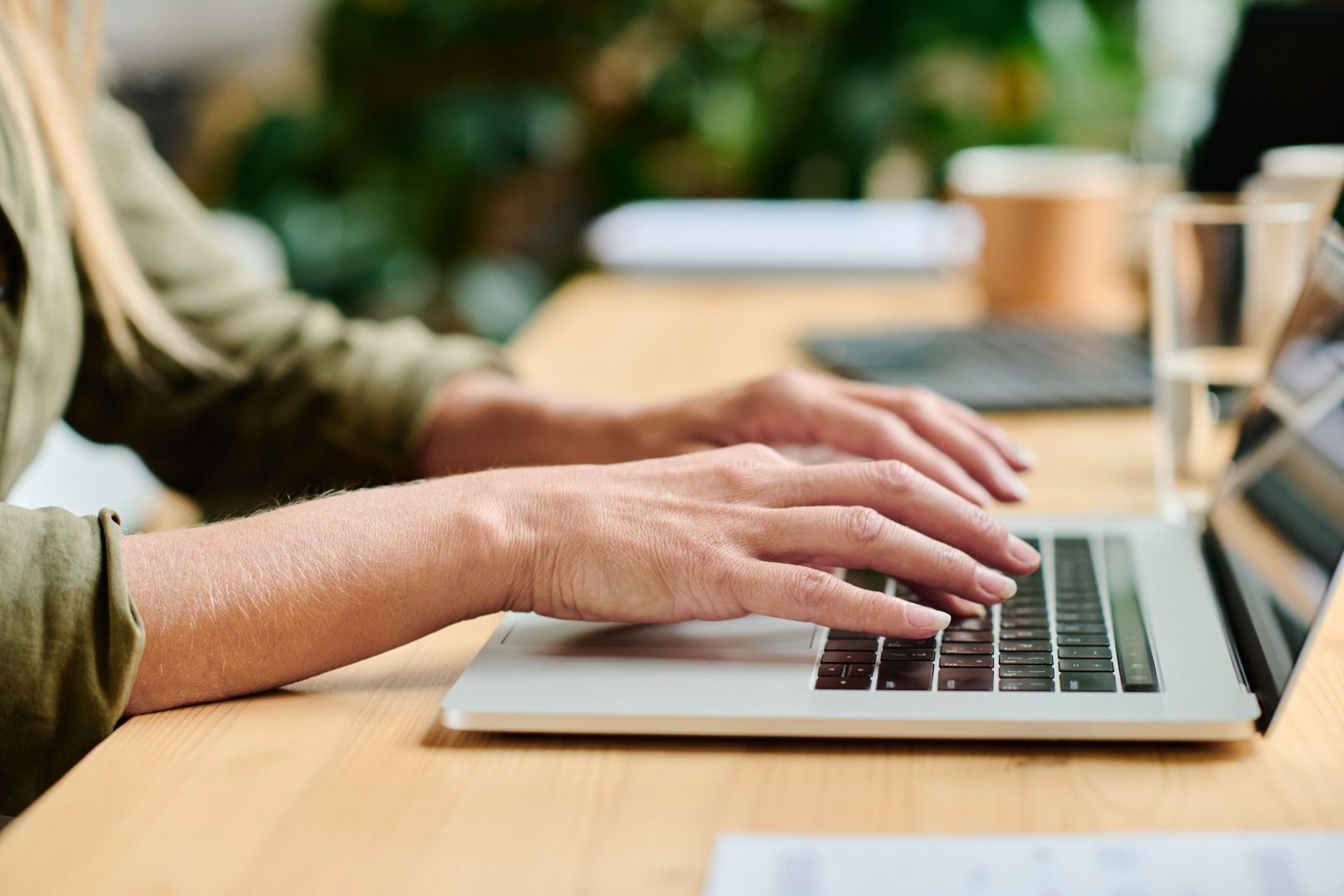 Hands using laptop