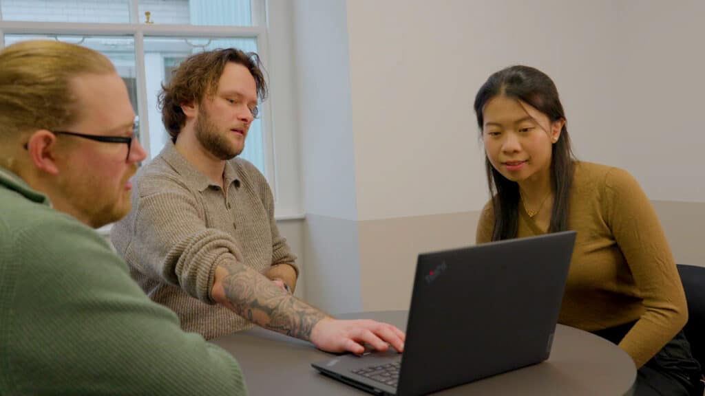 Three people talking