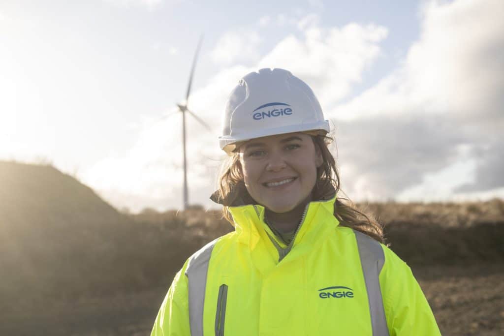 ENGIE employee infront of wind turbine - Glasgow