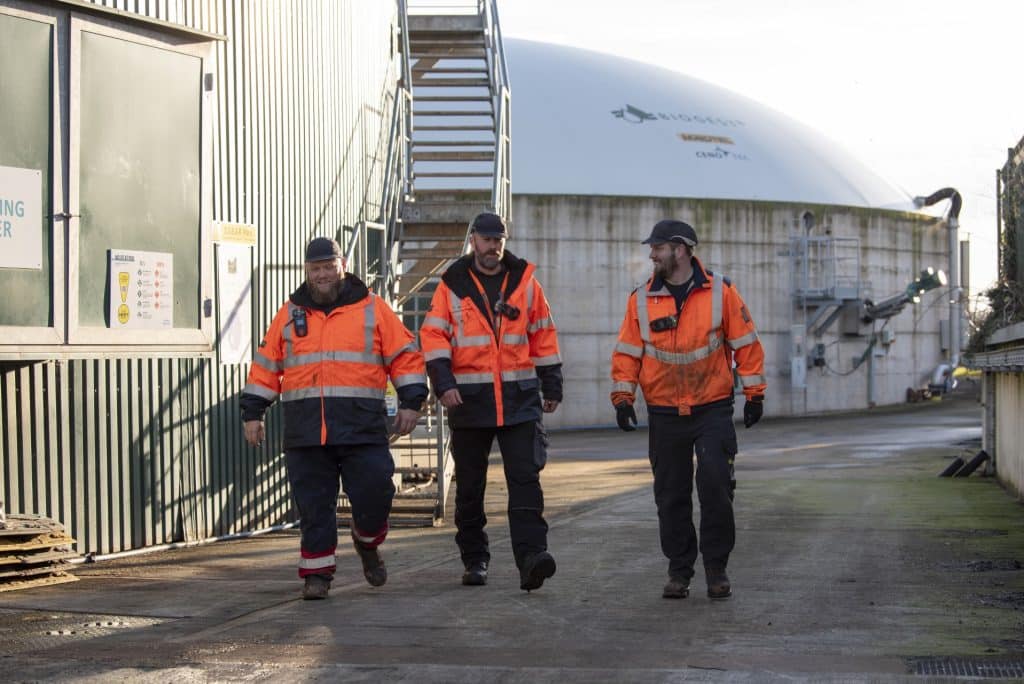 Team of 3 wakling through Gorst site with Dome in background (3) (Resized)