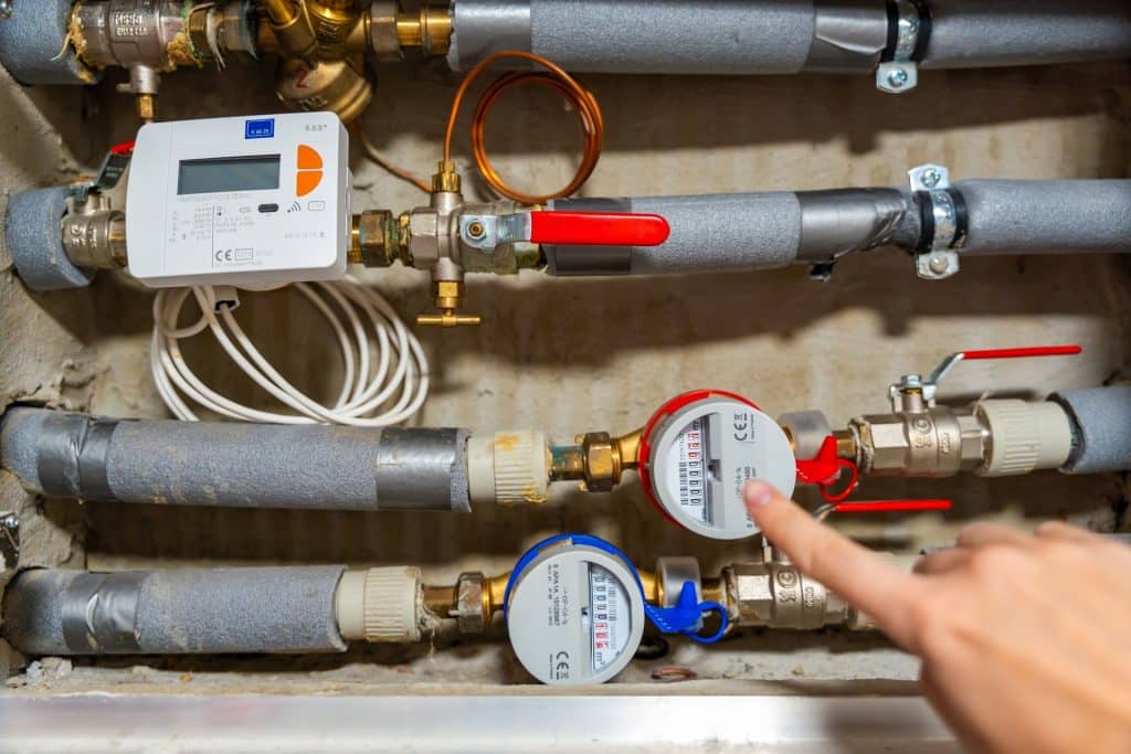 Smart water and heat meters with remote data transmission installed in a European utility system. The concept represents modern energy efficiency and digital infrastructure development.