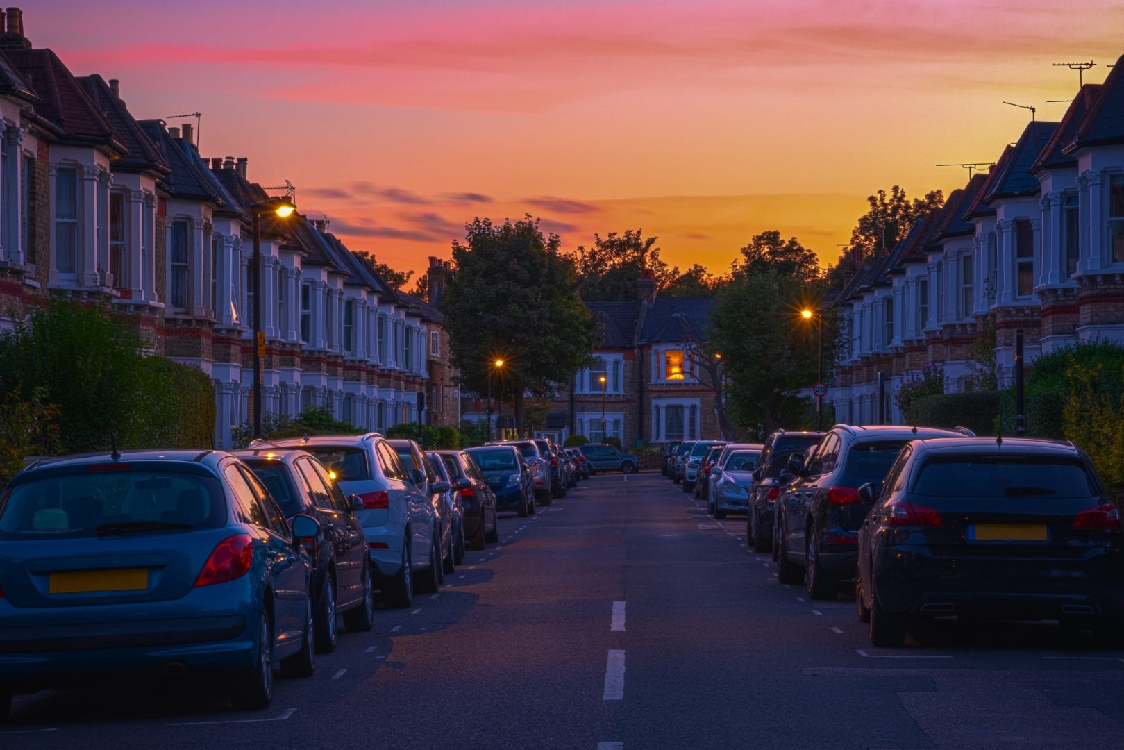Sunset at a street of terraced houses around West Hampstead in London, England